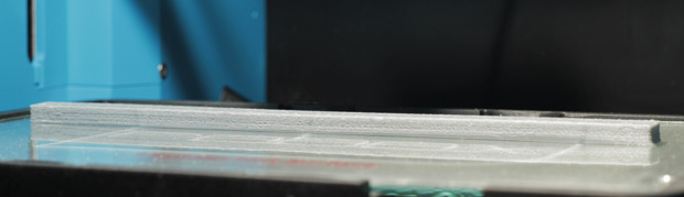Test print: ABS 78x10x5mm - Draft quality -This test print using ABS in our closed build chamber shows no shrinkage or warping even when the bed and part have cooled.