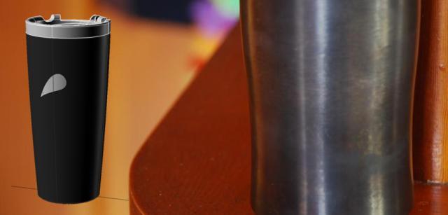 this photo shows the black oxide coating on a prototype mug; in the inset a computer-generated rendering of the complete mug is shown