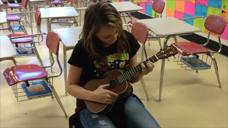 Brooke practices her scales.