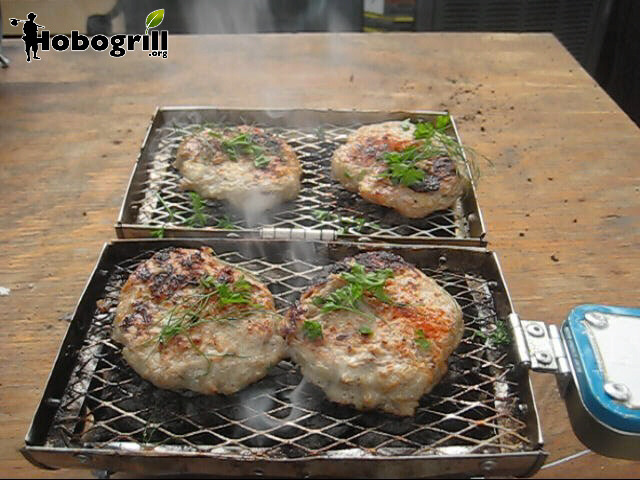 Double sided cooking is possible with all Hobogrill HG2 series grills. Turkey burgers for two garnished with parsely and paparika