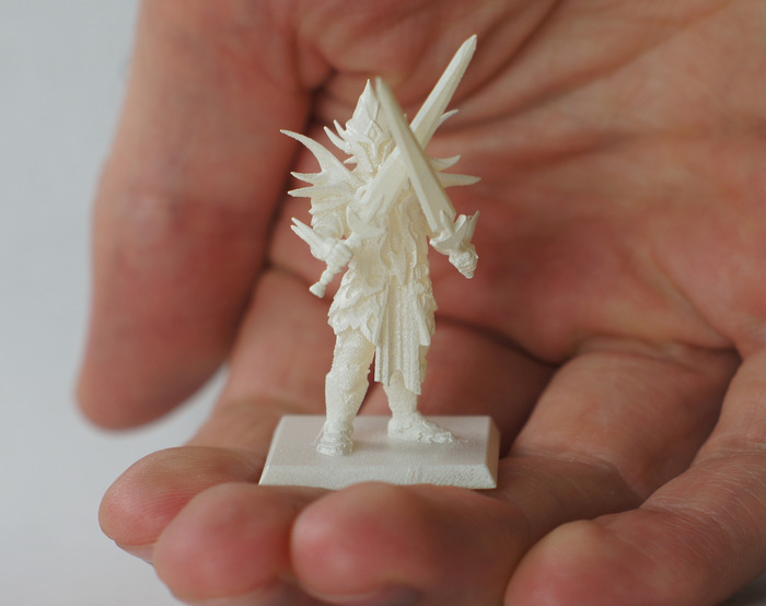 Something as simple as a mini with swords crossed in front of him would be impossible with injection molds.
