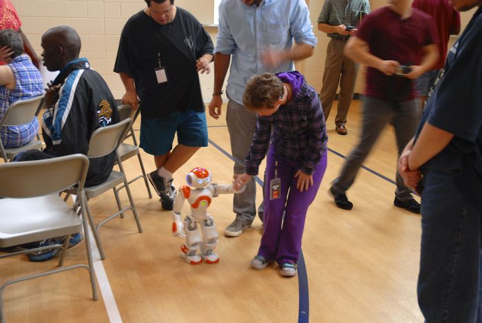 Here's NAO, an advanced humanoid interacting with our robotics club. What if we could create a very low cost robot that was simple but which served as a friend and teaching tool?