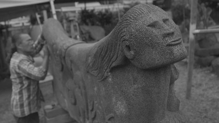Hoaka's carving of "Papa and Wakea" tells the Hawaiian story of creation.