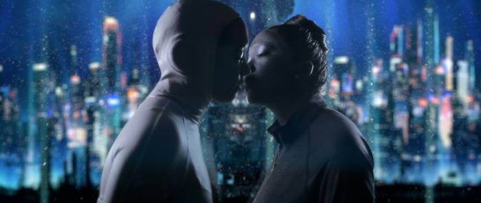 Occupant kissing Loved One as she is about to depart on the space elevator. (The elevator tower base structure behind splits them in frame. Symbolic of their separation).