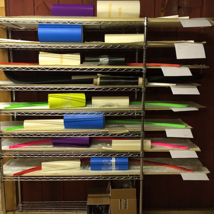 All of the prepped materials for multiple prototypes in layup order.