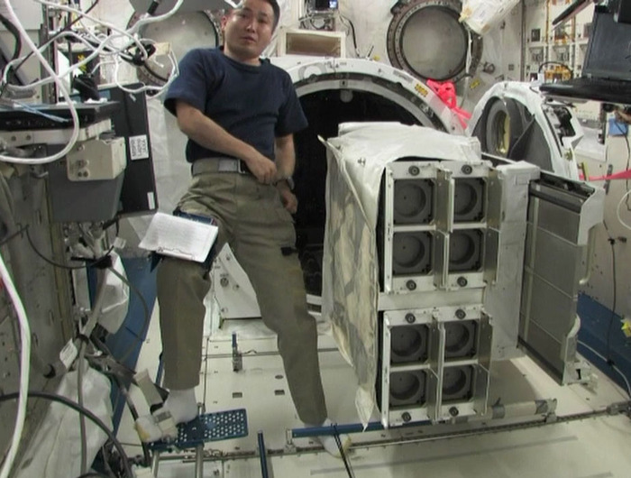 Astronaut Koichi Wakata floats inside ISS next to the NRCSD with SkyCube inside!