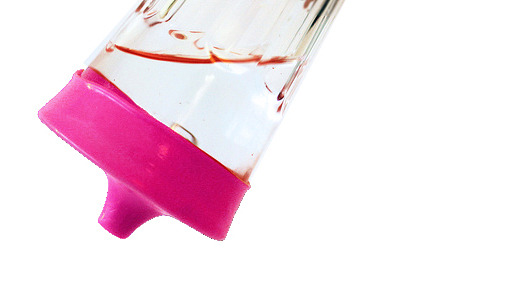 The silicone grips to the cup very tightly, so even with the weight of liquid contents it will not come off.