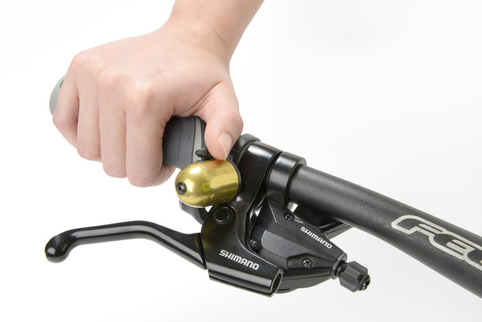 Trigger Bell fitted on trigger shifter. Note it's above the handlebar on the right hand side and still more accessible than a traditional bell