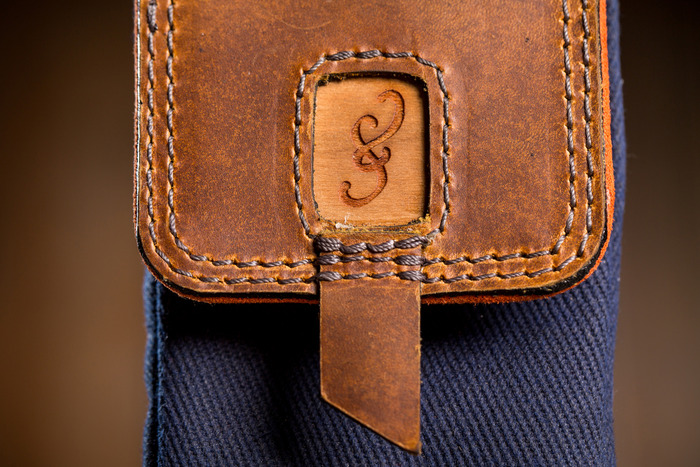 Parachute grade stitching with a real cherry wood ampersand