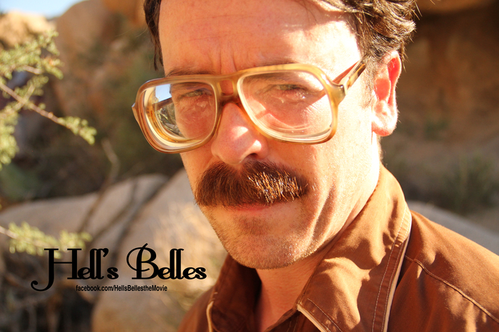 A scientist searches for clues in the desert.