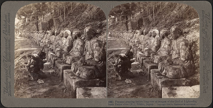 Praying man before the statues of Jizo, protector of travellers. Nikko, 1904. Tekniska Museum.