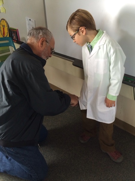 Sound Engineer Ray Day wires up Elliot for filming