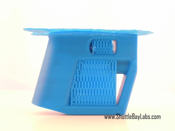 Handle straight from the printer. The raft (on the top) and the other support structures easily pop off