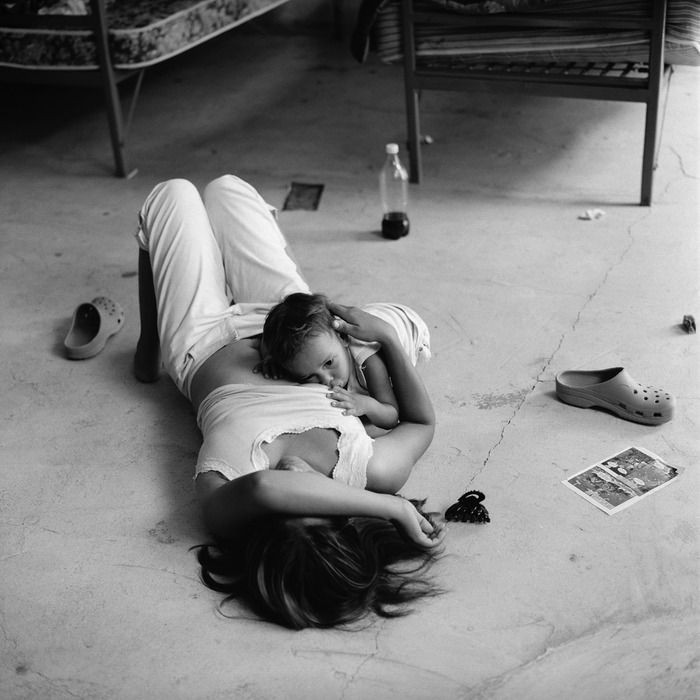 A Salvadoran migrant feeds her infant son at Casa de la Misericordia migrant shelter in Arriaga, Chiapas. Arriaga is one point of origin for the network of northbound freight trains that migrants use as a way of reaching the United States border (2010).