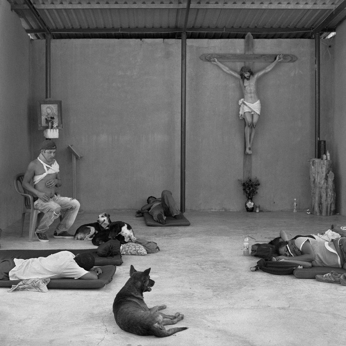 Weary and injured migrants rest in the makeshift chapel of the Hermanos en El Camino migrant shelter in the town of Ixtepéc, Oaxaca (2009).