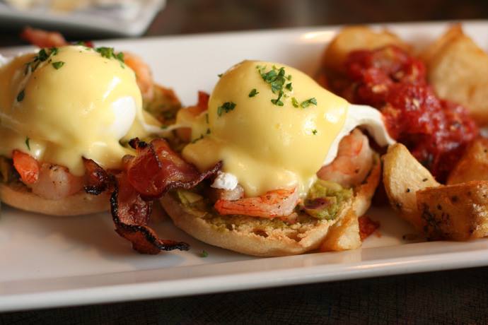 Our version of Eggs Benedict includes Bacon and Shrimp
