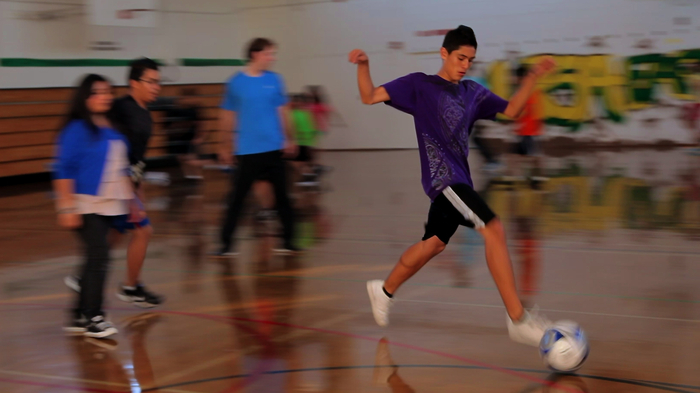 The Futbolistas scrimmaging in the gym.