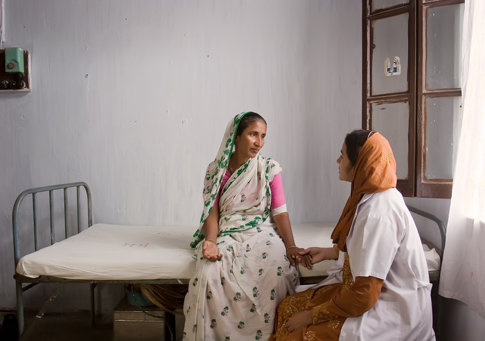 In Dhaka, Bangladesh, this woman just received a long-term birth control implant. She is being counseled by her physician.