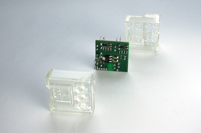 There are three connector holes and one power source port located on the underside of the SBrick. The electronics and the identifying LED are in the middle. The top has four PF control ports.