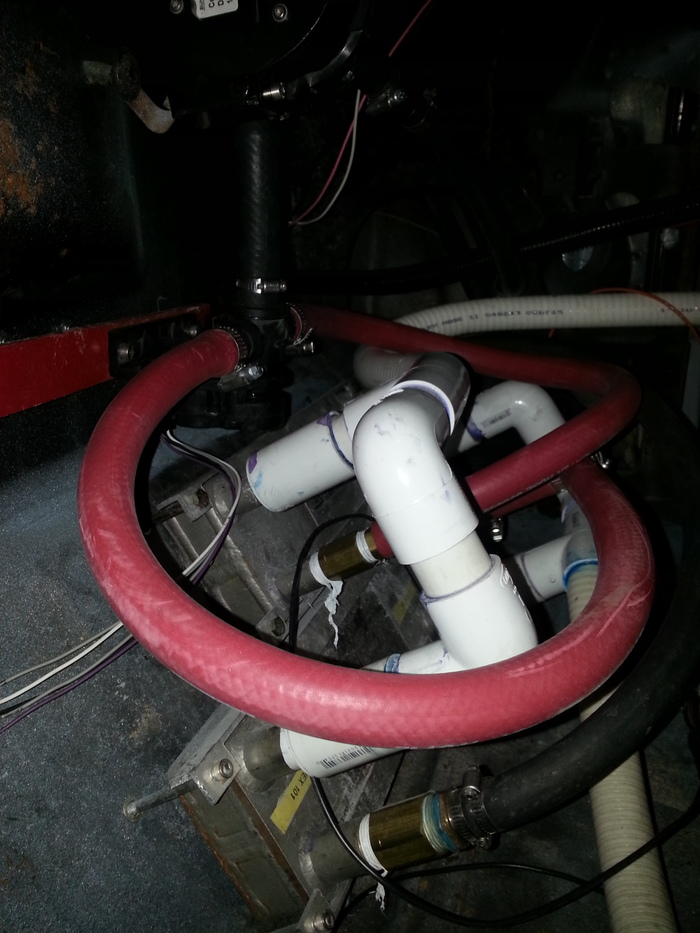 Park some heat exchangers in the passsenger's foot well to heat the water in the tub using the engine.