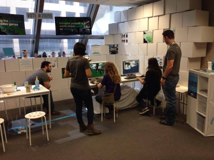 Some of the first children playing our prototype at an event in April, with co-founders (from left) Ryan, Caroline, and Paul looking on.