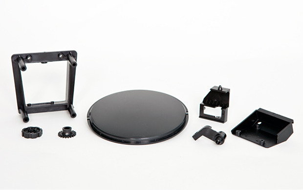 Sample manufactured thermoplastic parts from our T0 injection molds (Kittyo lid, gears for treat dispenser and housing parts for the camera and laser). Note: not final colors.